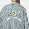 1989-Logo, gestreift, mit Knöpfen 1989-Logo, gestreift, mit Knöpfen