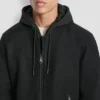 Bomberjacke aus Kunstwolle mit Kapuze und Latzhose Bomberjacke aus Kunstwolle mit Kapuze und Latzhose