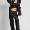 Hoch taillierte Hose mit Logo-Bund und weitem Bein Hoch taillierte Hose mit Logo-Bund und weitem Bein