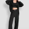 Hoch taillierte Hose mit Logo-Bund und weitem Bein Hoch taillierte Hose mit Logo-Bund und weitem Bein