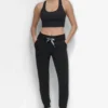 Hoch taillierte, zweifarbige Jogginghose mit Logo und Kordelzug Hoch taillierte, zweifarbige Jogginghose mit Logo und Kordelzug