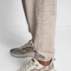Jogginghose mit erhabener Stickerei und Strass-Logo Jogginghose mit erhabener Stickerei und Strass-Logo
