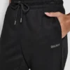Jogginghose mit Strass-Logo und Bündchen Jogginghose mit Strass-Logo und Bündchen